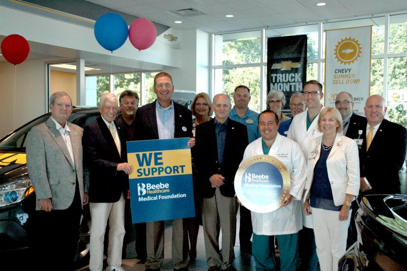 I.G. Burton and Company Inc. has made a generous donation to Beebe Healthcare's Cardiac and Vascular Services. Shown at the i.g. Burton location in Lewes are (l-r) Tommy Cooper, chairman of the board, Beebe Medical Foundation; the Hon. William Swain Lee, chairman of the board, Beebe Healthcare; Pete Renzi, director of operations, i.g. Burton; Charles Burton, owner, i.g. Burton; Lynn Amey, MHA, BSN, RN-BC, executive director of cardiac and vascular services, Beebe Healthcare; Jeffrey M. Fried, FACHE, president and CEO, Beebe Healthcare; MJ Lofland, director of sales, i.g. Burton; Dr. Carlos Neves, Beebe vascular surgeon; Diane Barlow, gift planning officer, Beebe Medical Foundation; George Schifferer, director of parts and service, i.g. Burton; Dr. Sean Ryan, Beebe vascular surgeon; Judy Aliquo, CFRE, president and CEO, Beebe Medical Foundation; Rick Schaffner, RN, executive vice president and chief operating officer, Beebe Healthcare; and Tom Protack, vice president of development, Beebe Medical Foundation...